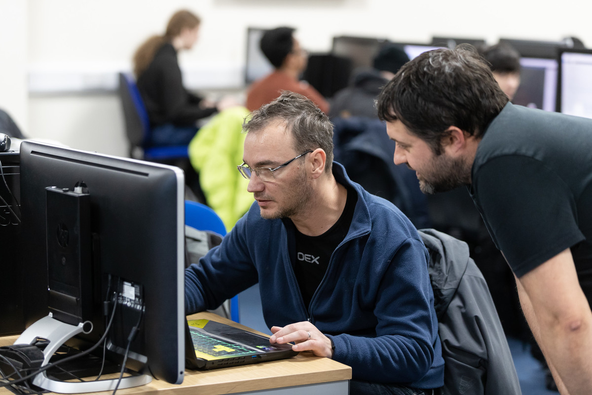 Two people at a computer