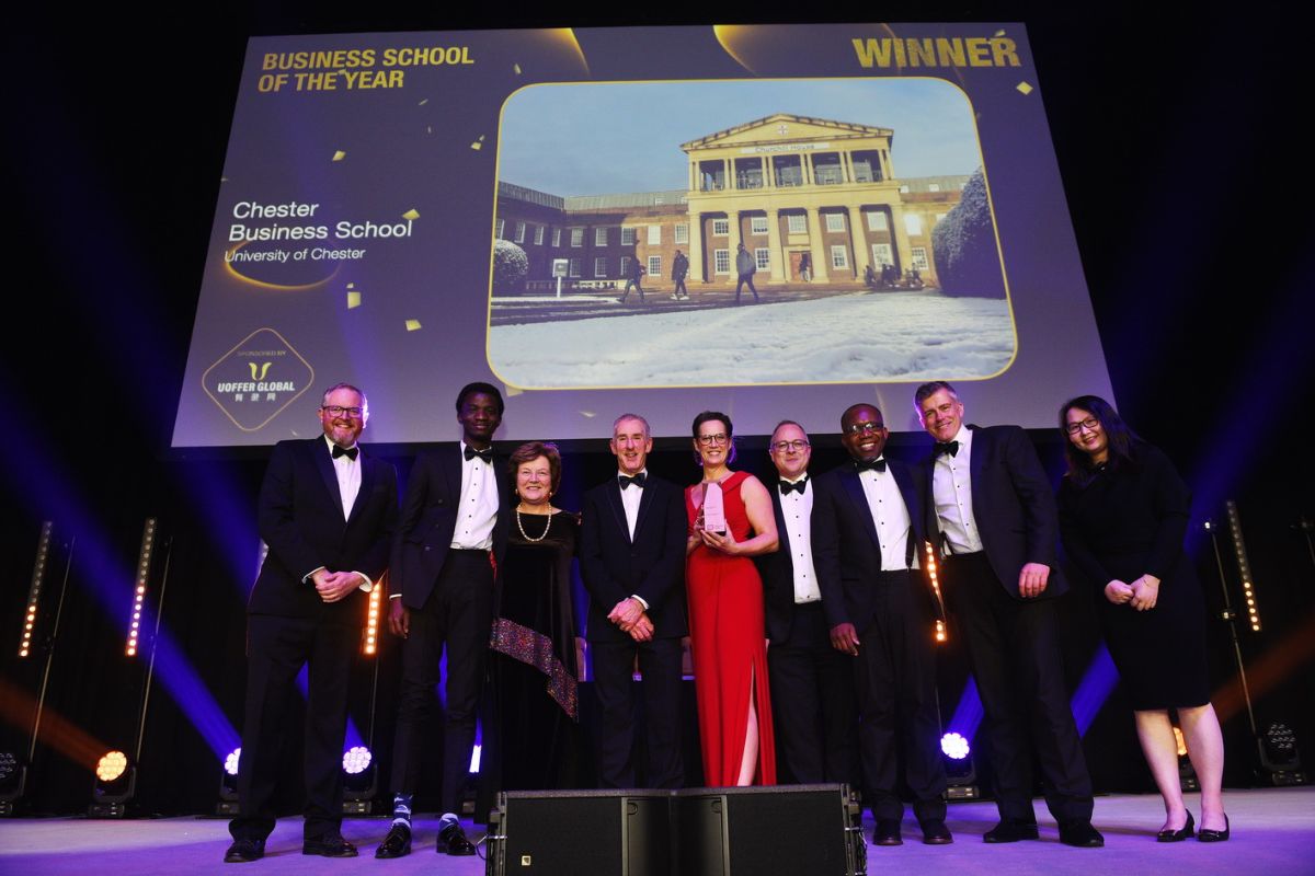 The University of Chester celebrates collecting the Business School of the Year award.
