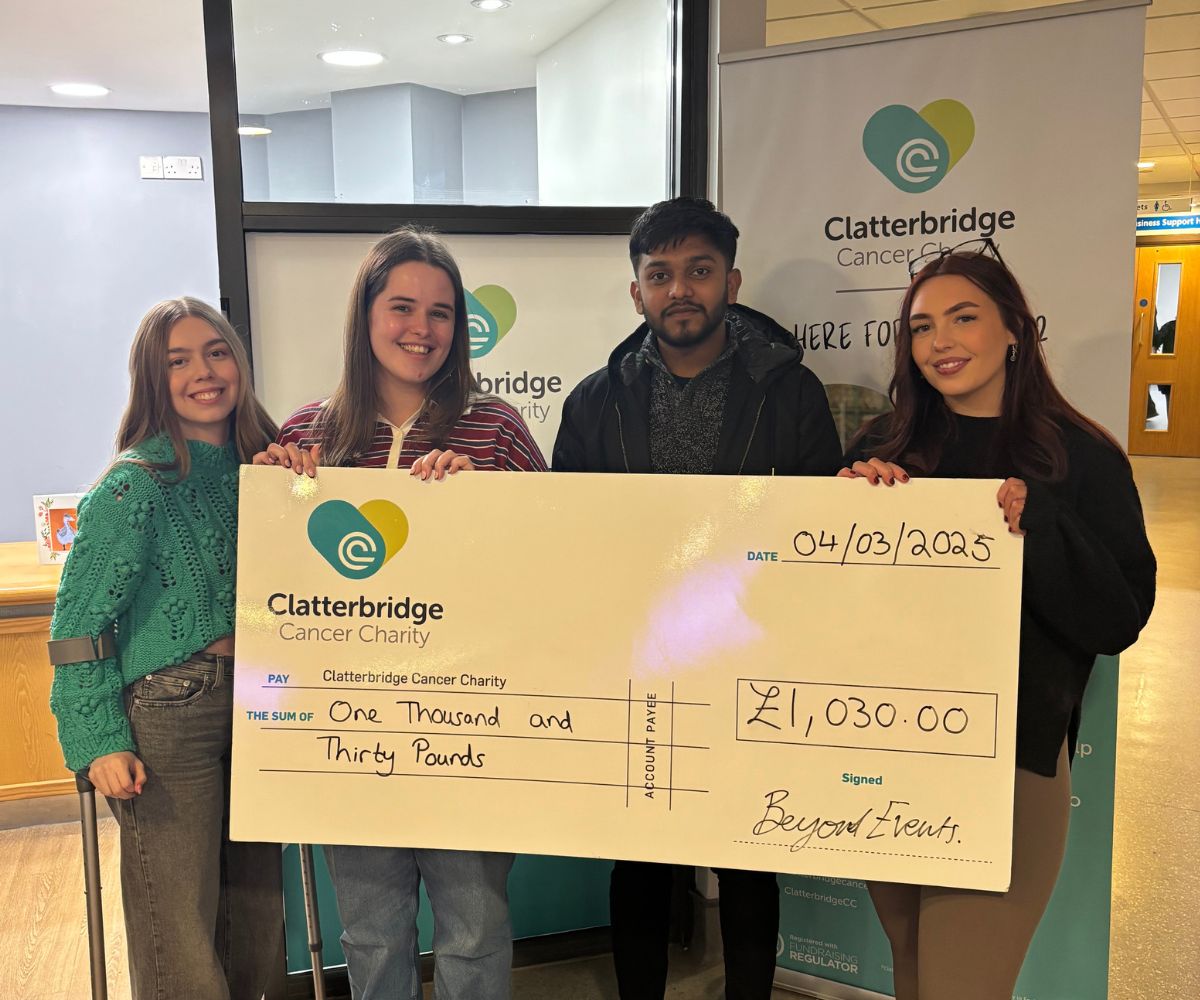 The Beyond Events student team presenting their fundraising cheque to Clatterbridge Cancer Charity.