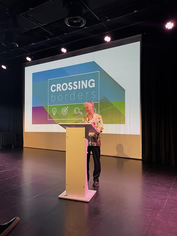 Associate Professor Evelyn Jamieson speaking at a previous Crossing Borders event.