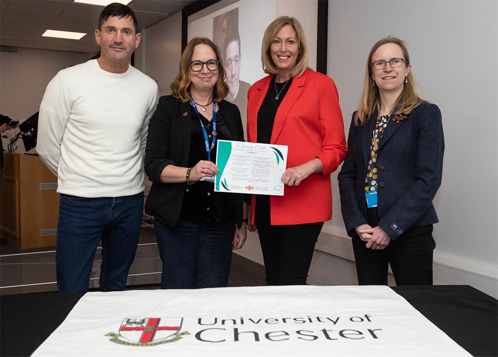 A group of staff signing pledge by University of Chester supports people in recovery